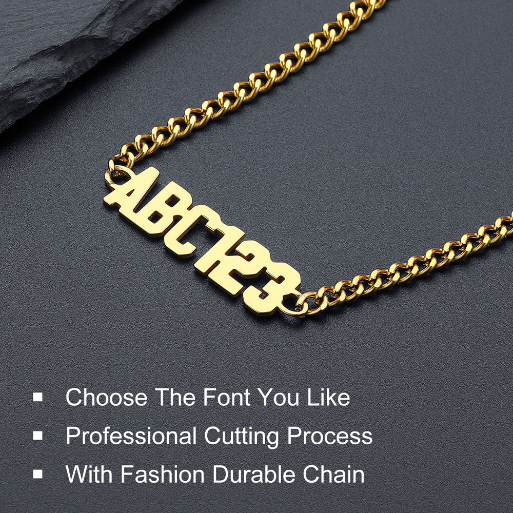 Gold chain necklace with customizable letters and numbers on a dark background