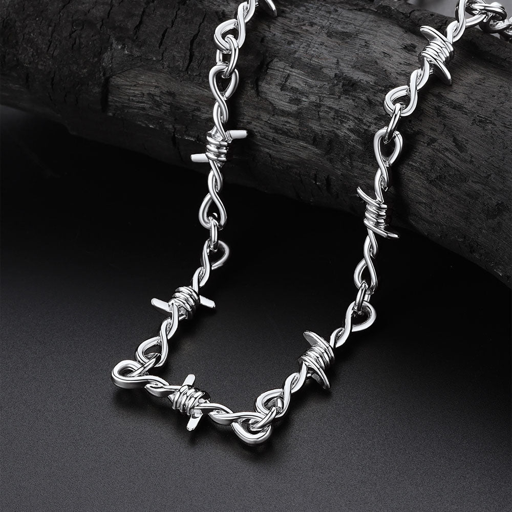 Silver chain bracelet on a dark surface