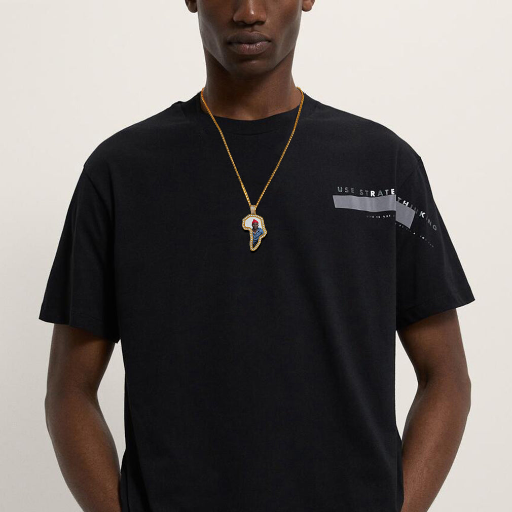 African map pendant necklace on a man, gold chain and black t-shirt
