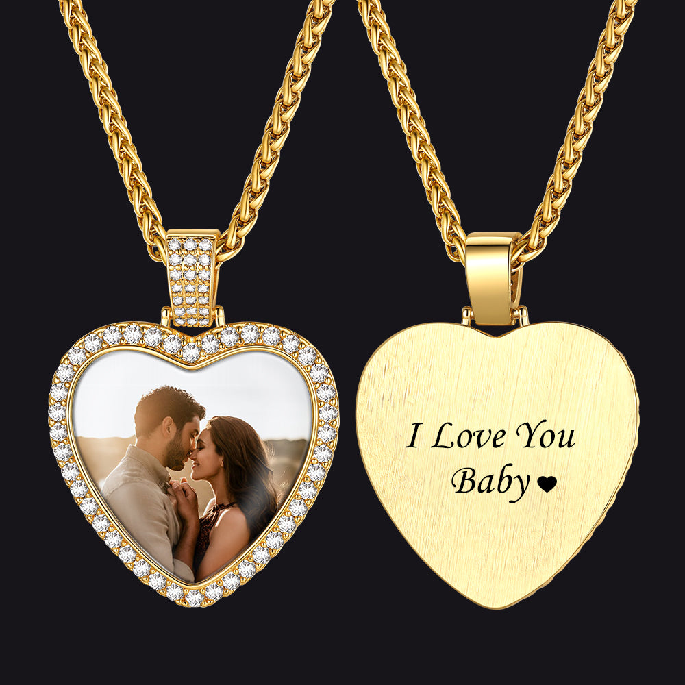 Heart-shaped gold pendant with photo insert and 'I Love You Baby' engraving on a black background