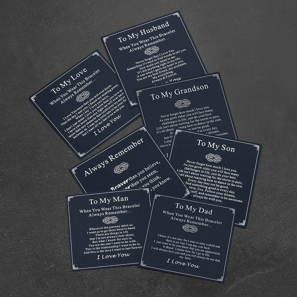 Set of personalized bracelets with engraved messages on a dark surface