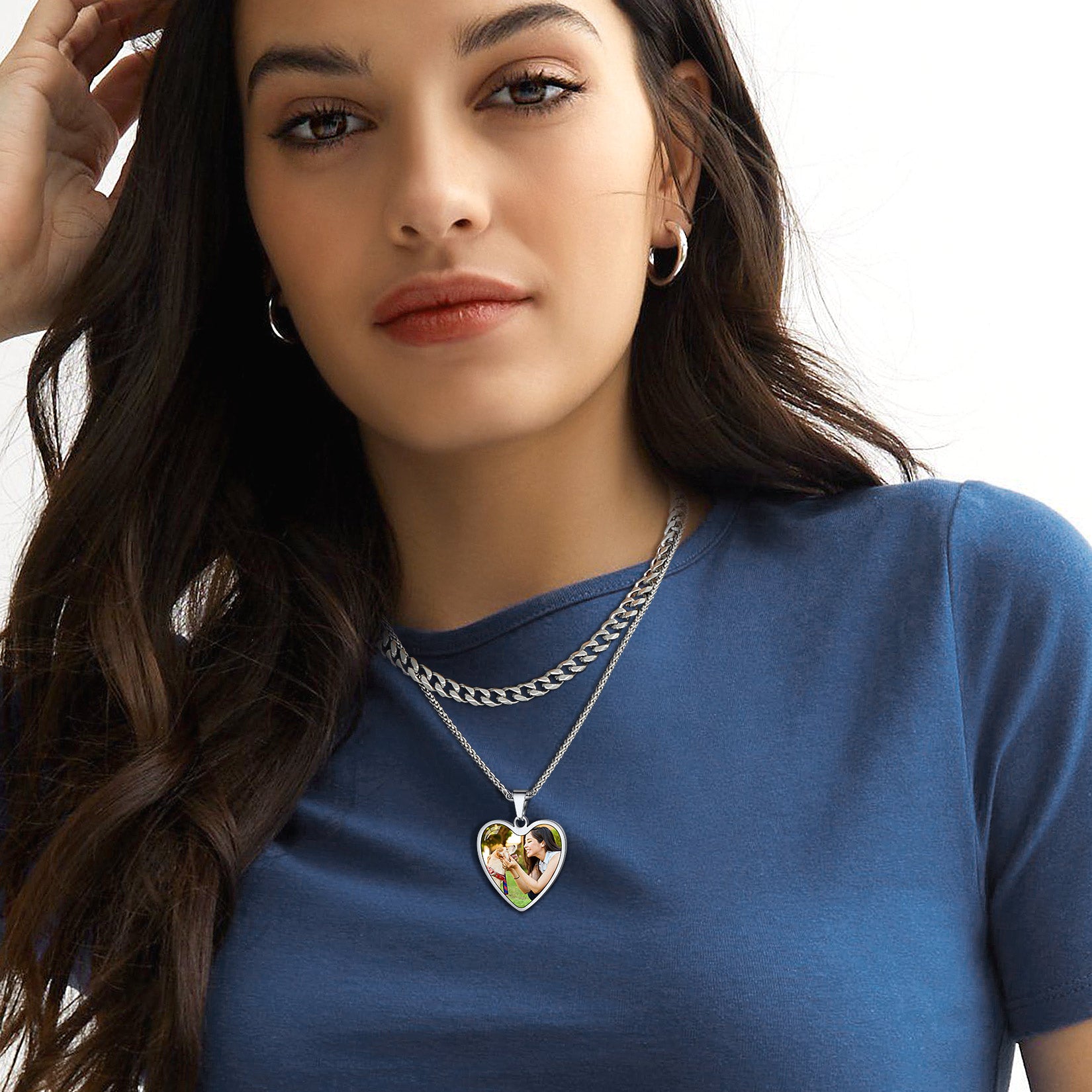 Woman wearing a heart-shaped necklace with a custom picture