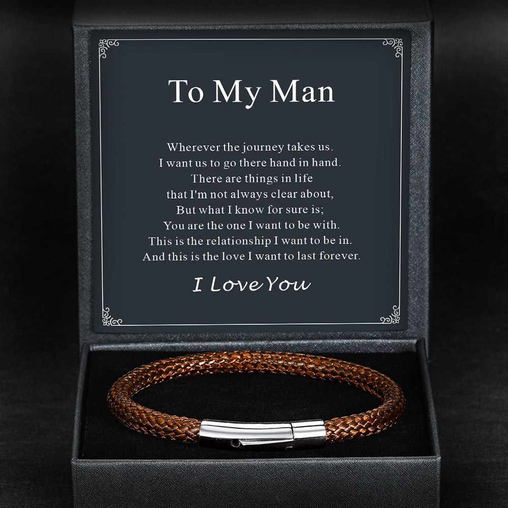 Brown braided leather bracelet with silver clasp in a black box with a sentimental message