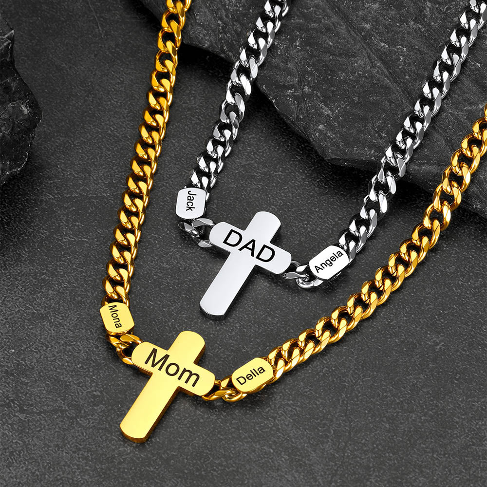 Three necklaces with cross pendants labeled 'Mom', 'DAD' on a dark stone surface.
