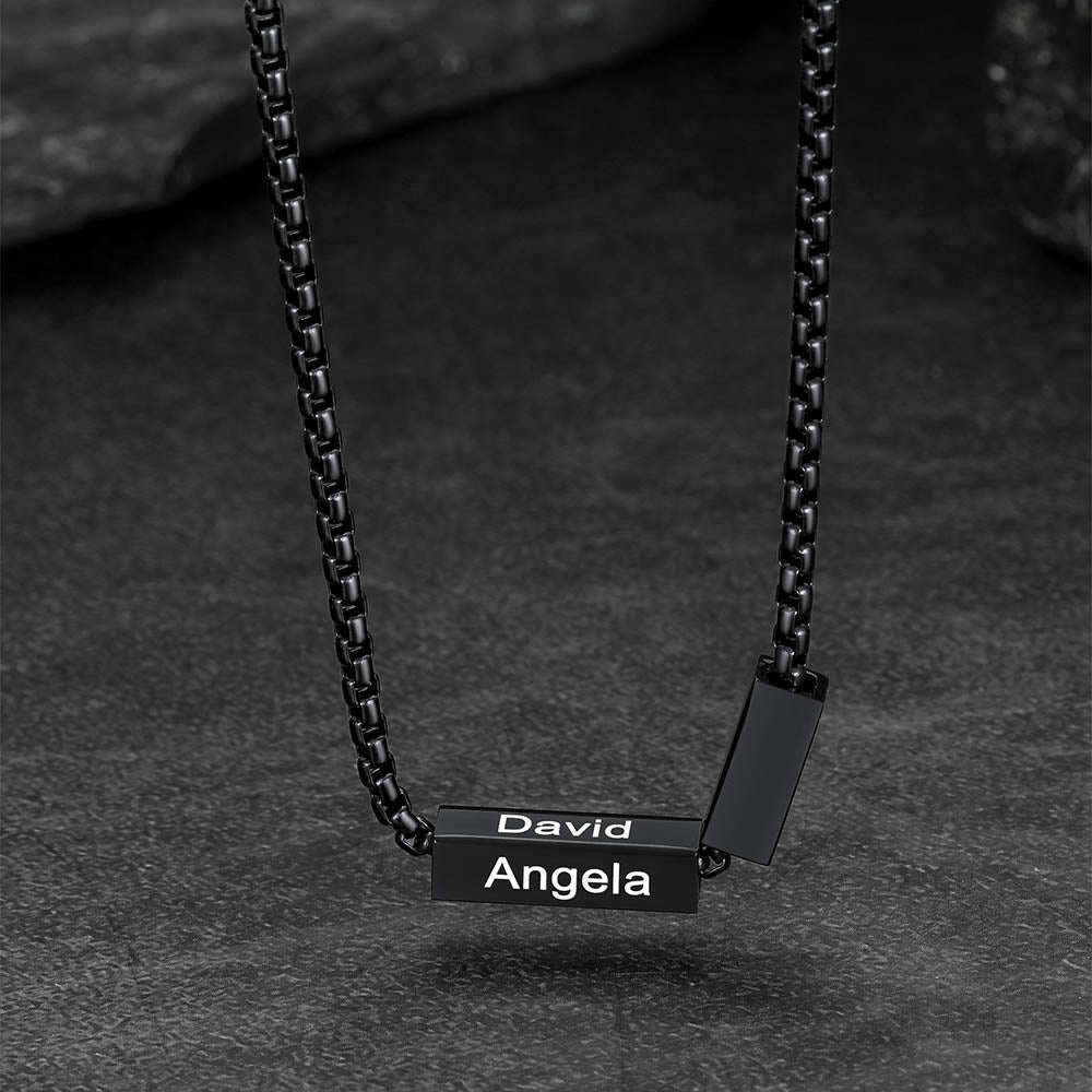 Black chain necklace with engraved names 'David' and 'Angela'