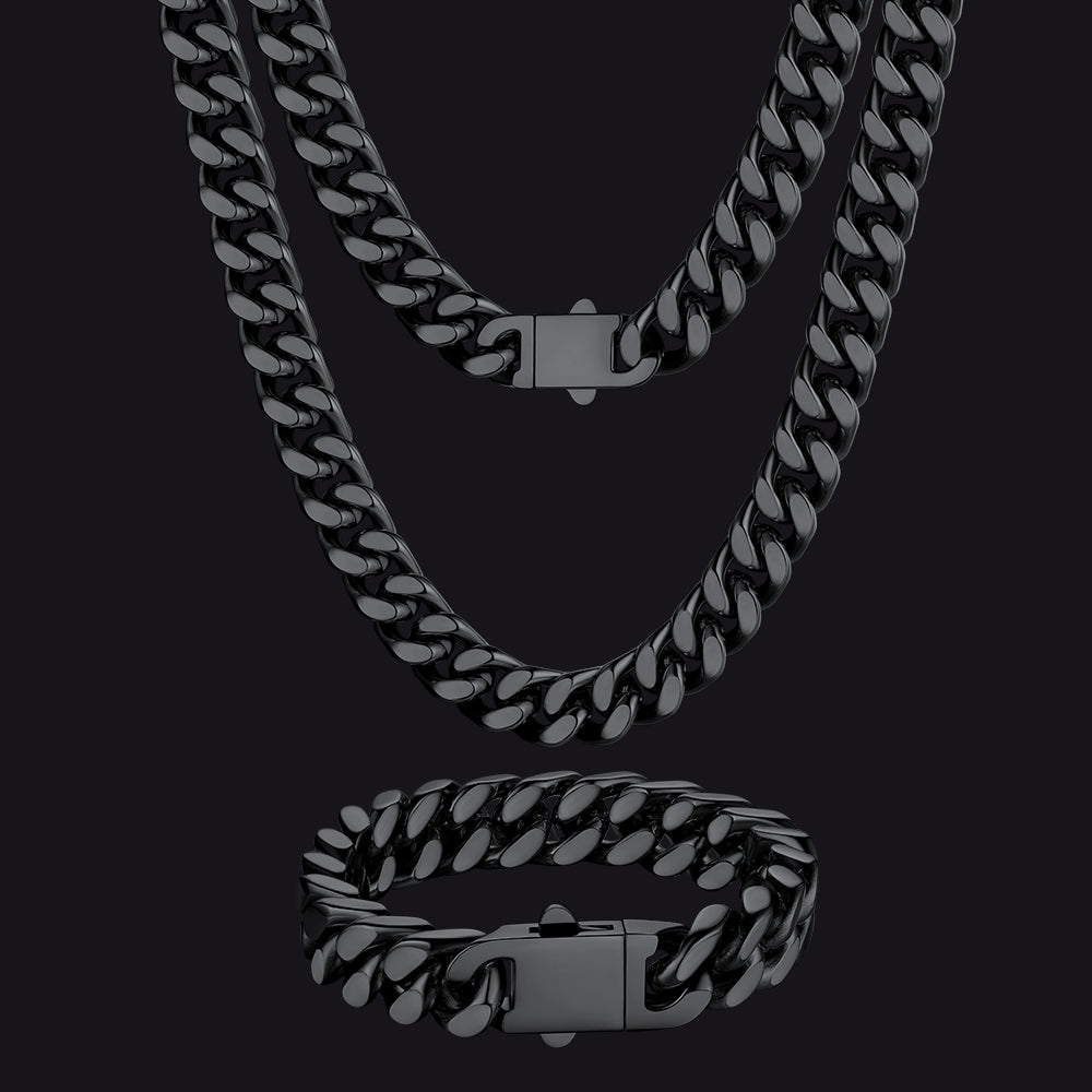 Black chain necklace and bracelet set on a black background
