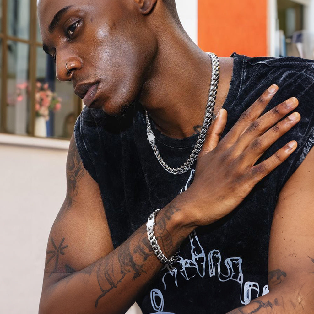 Male model wearing steel Miami Cuban chain and bracelet set