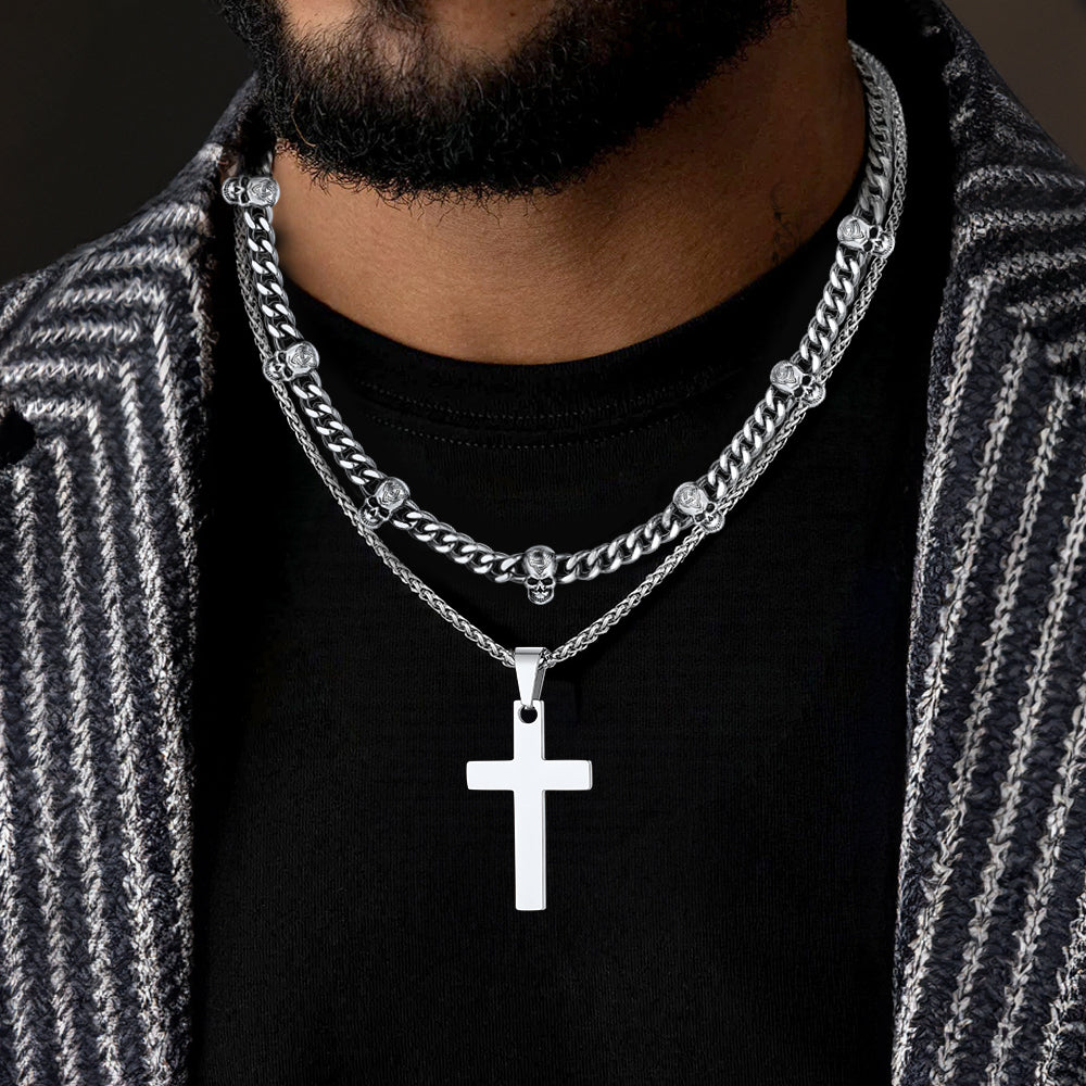 Man wearing Gothic skull and cross layered Cuban chain necklace for men
