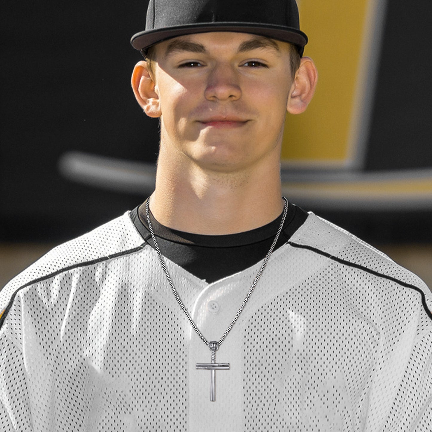 Baseball player wearing a cross pendant necklace