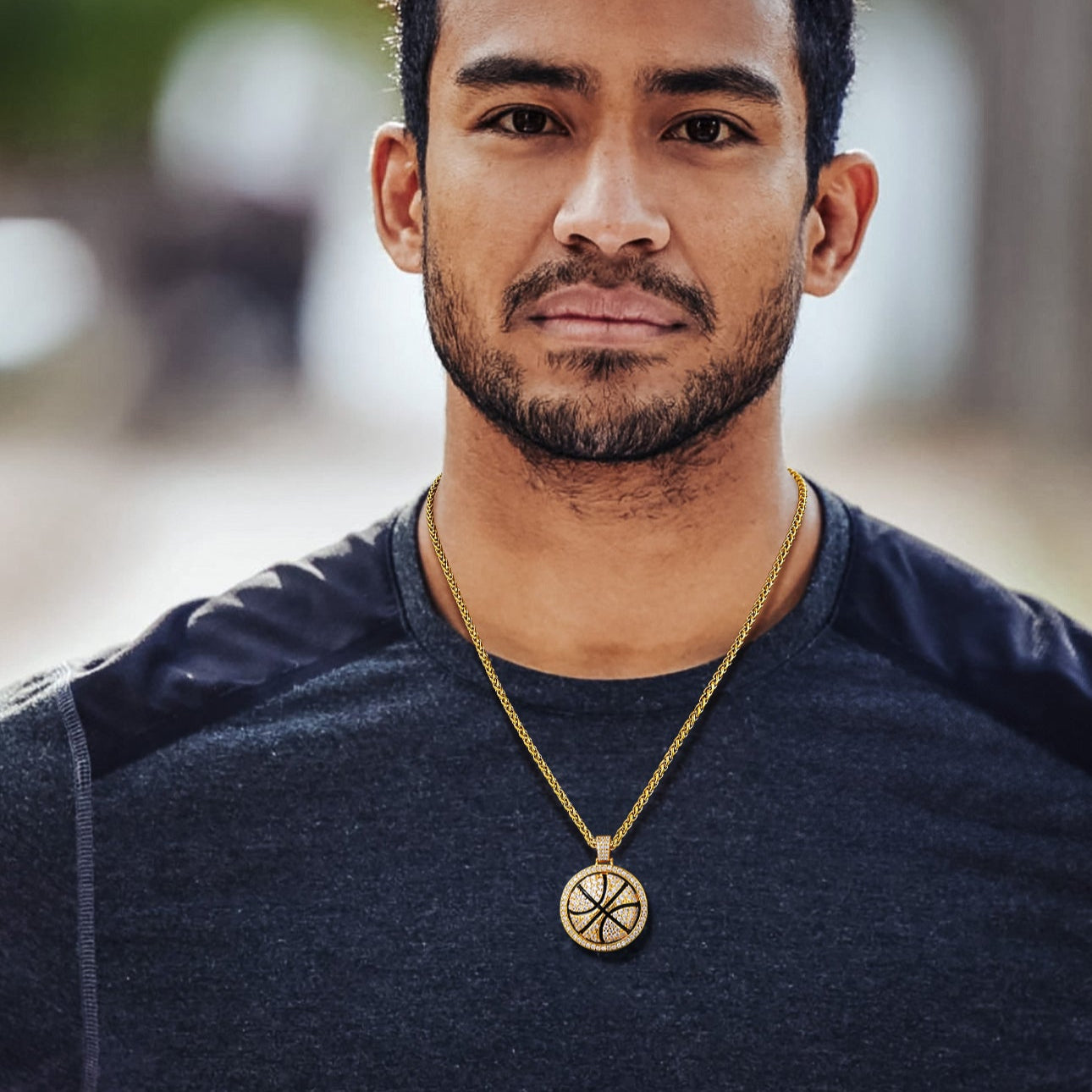 Man wearing a basketball pendant necklace
