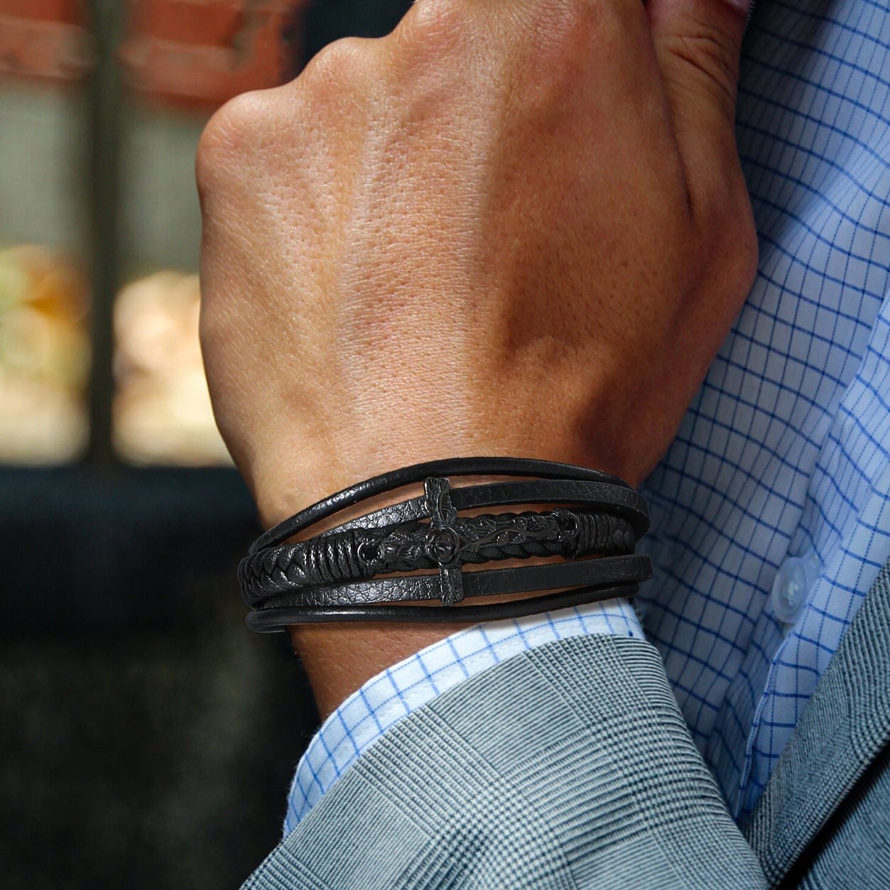 Christian Black Cross Leather Bracelet on Man's Wrist