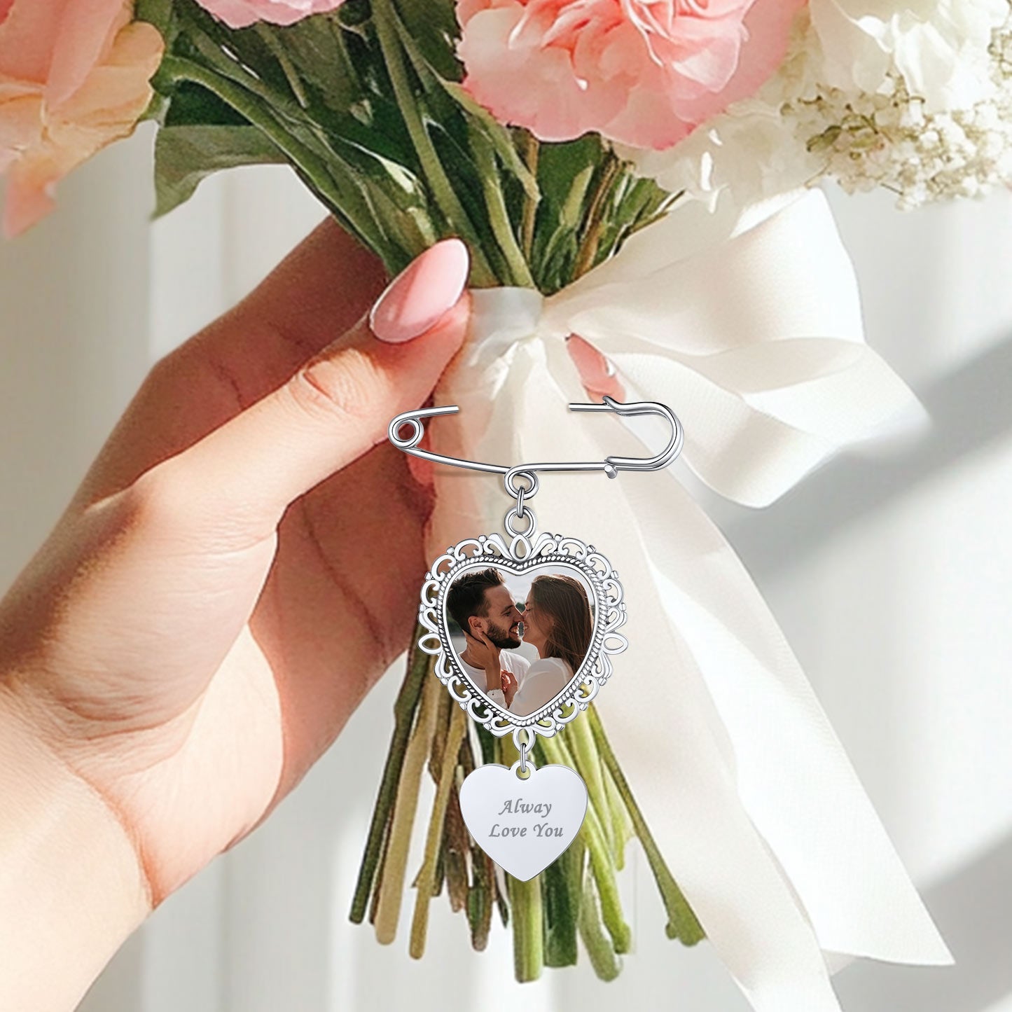 Wedding brooch with heart-shaped photo charm and 'Always Love You' engraving.