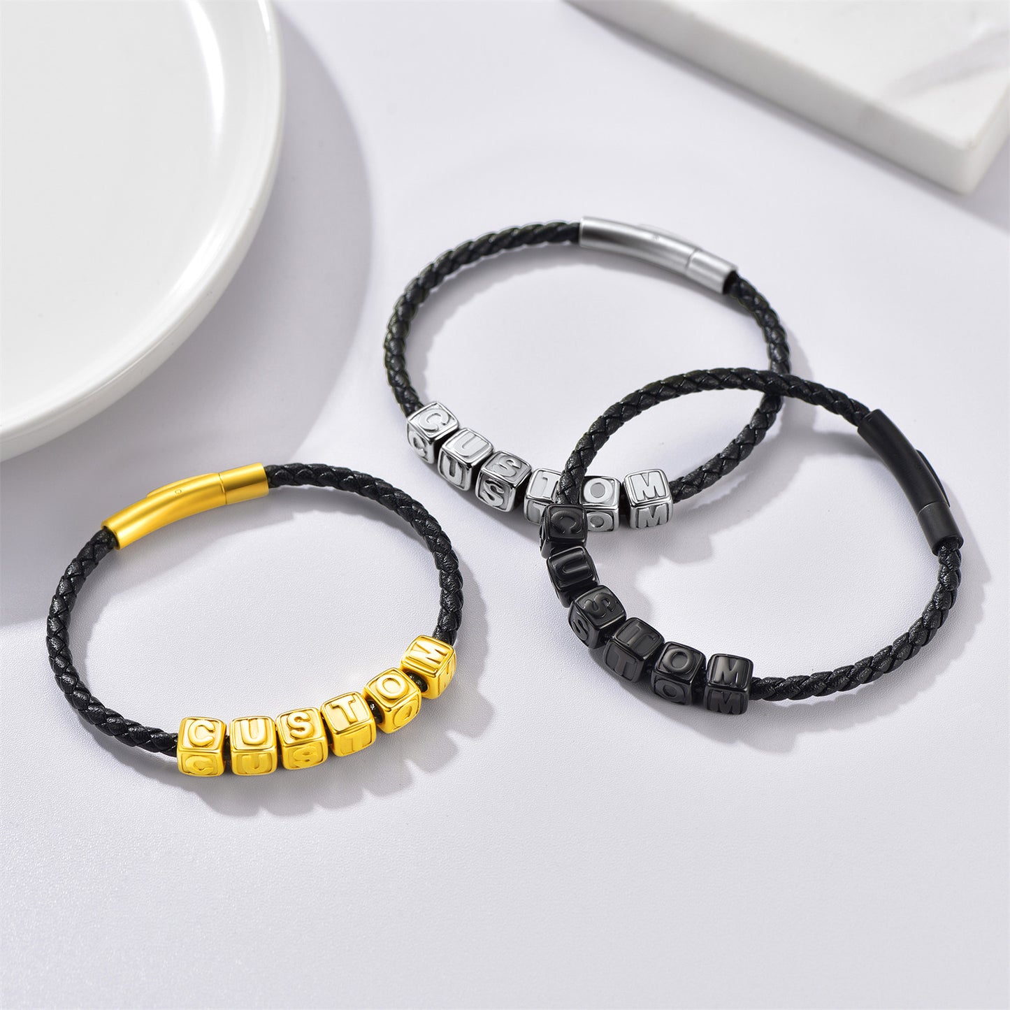 Trio of black, gold, and steel men’s beaded bracelets
