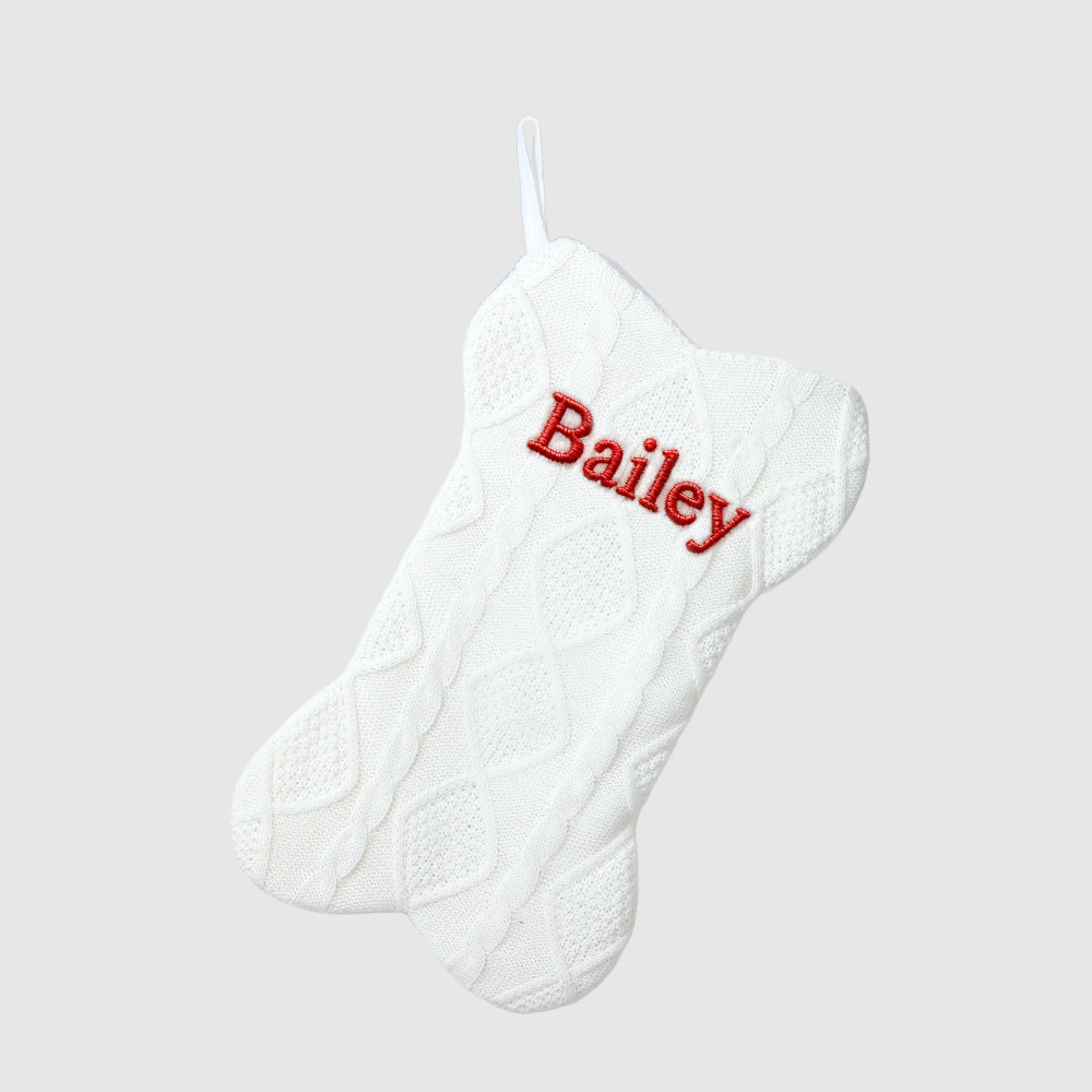 White Christmas stocking with 'Bailey' embroidered in red on a light gray background