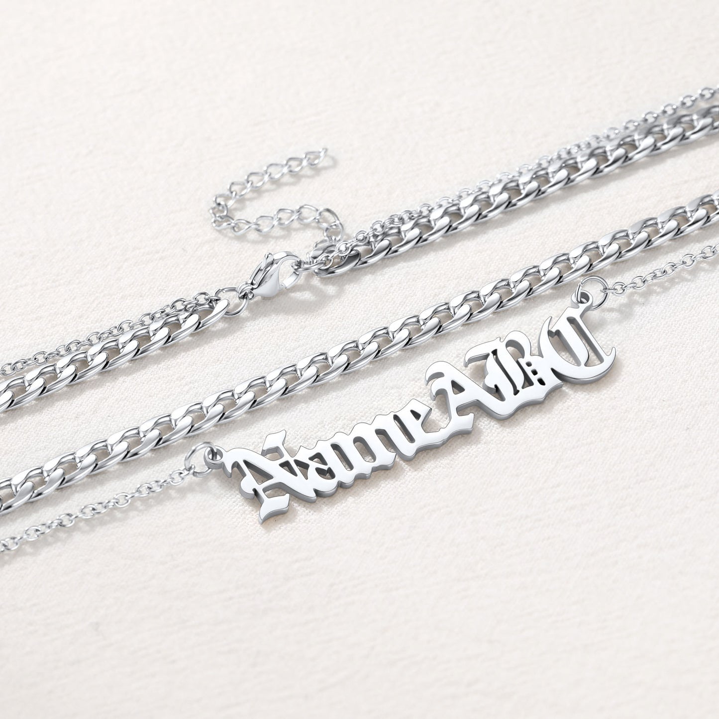 Close-Up of Steel Cuban Chain with Engraved Name Necklace – Custom Layered Set