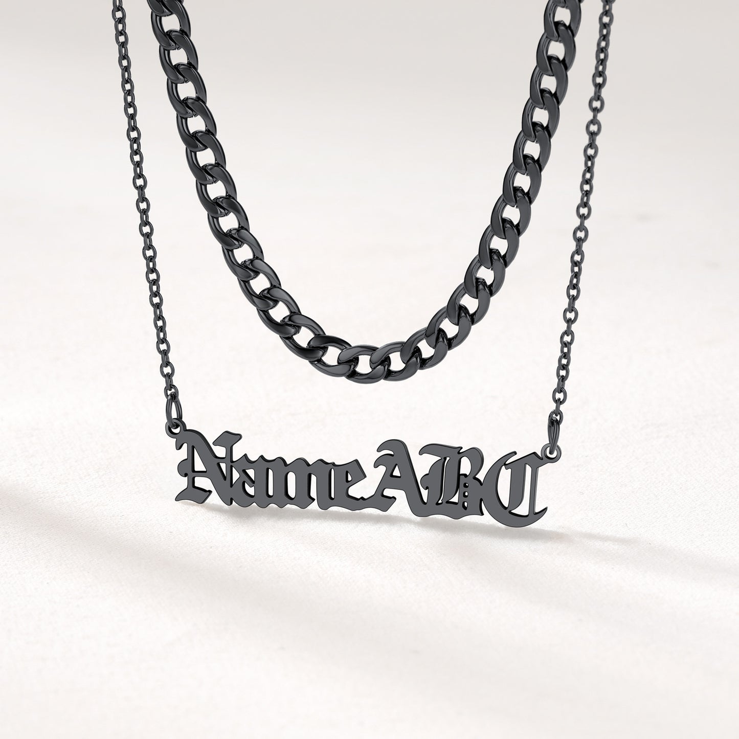 Close View of Matte Black Cuban Link and Custom Name Necklace Set