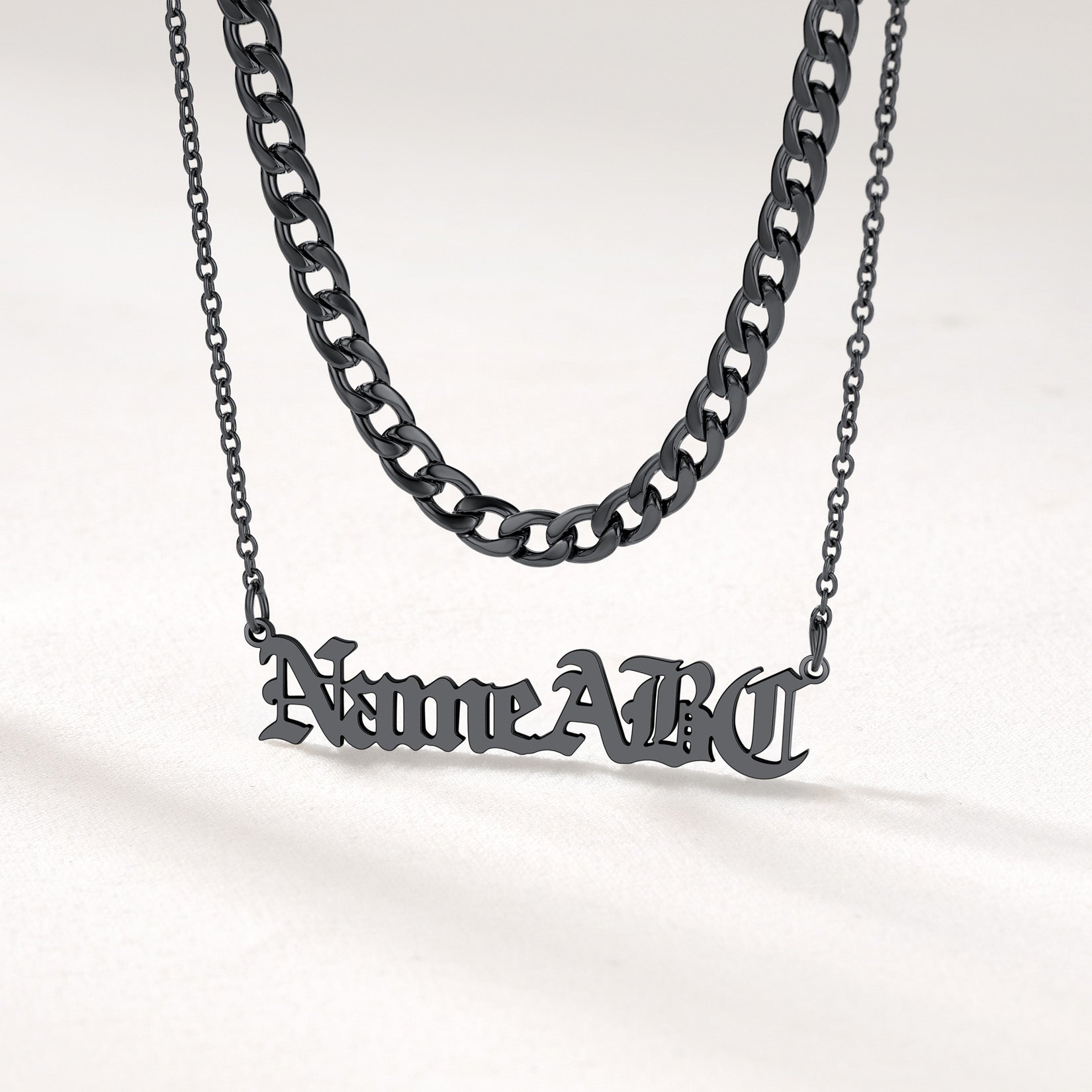 Close View of Matte Black Cuban Link and Custom Name Necklace Set