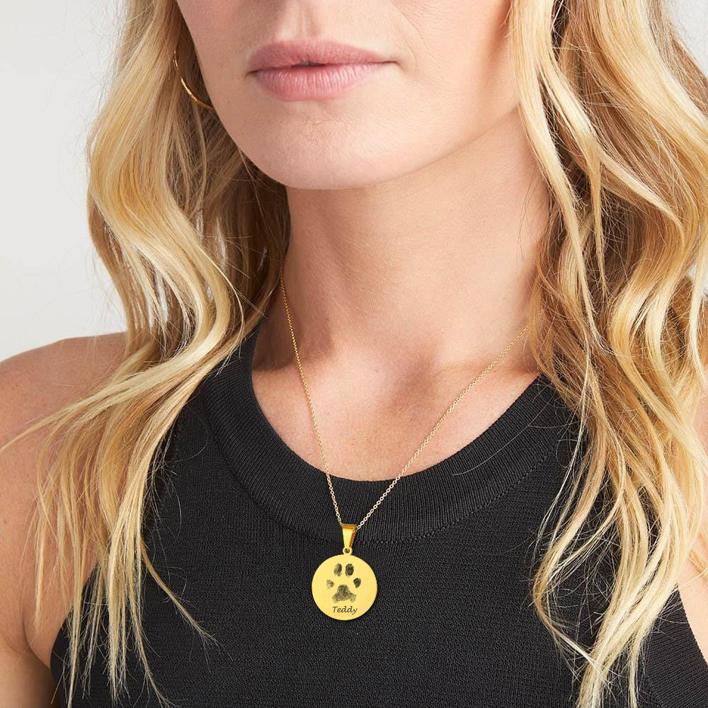 Woman wearing personalized pet photo necklace with casual outfit