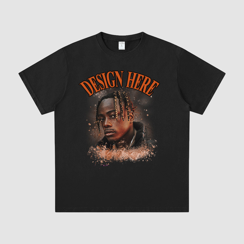 Black t-shirt with a graphic of a person's face and 'Design Here' text on a gray background