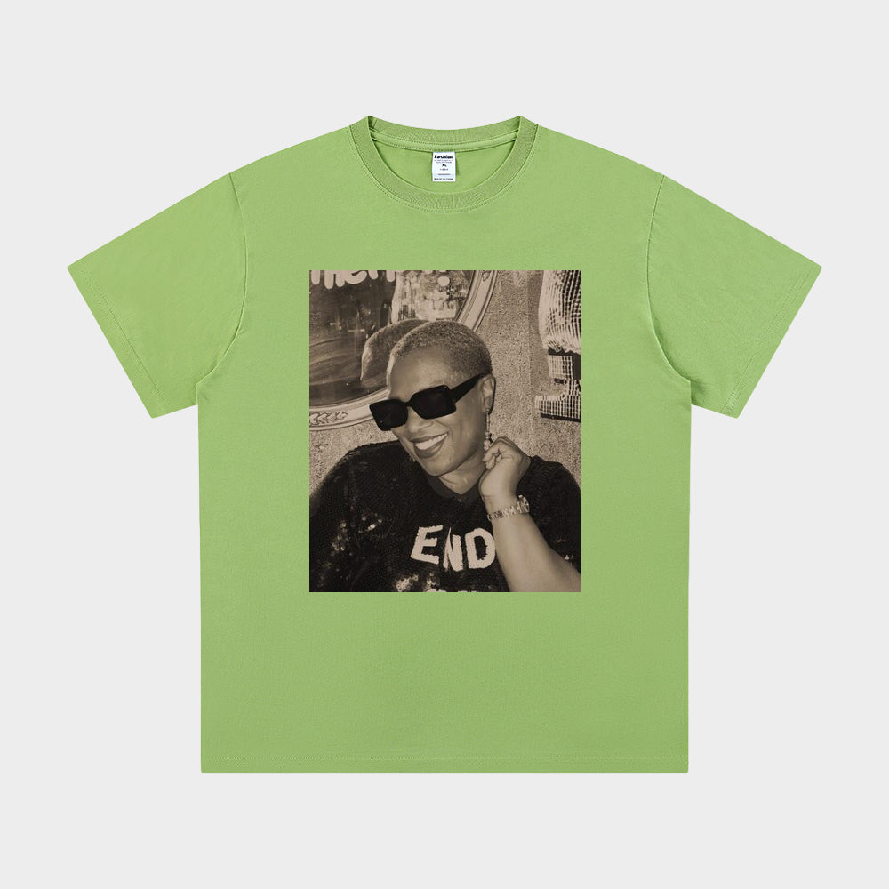 Green t-shirt with a graphic of a person wearing sunglasses and a 'END' shirt on a white background