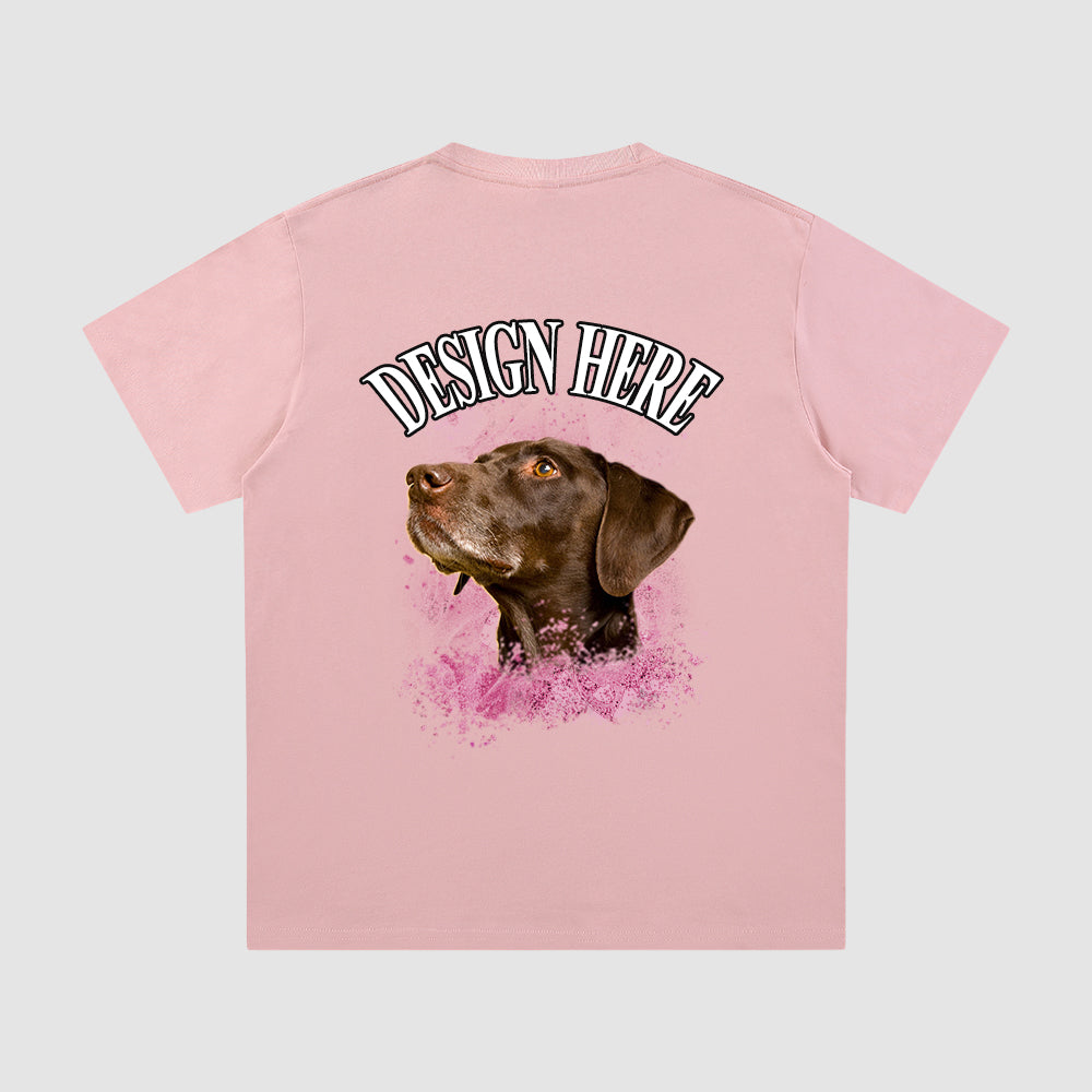 Pink t-shirt with a dog graphic and 'Design Here' text on a light gray background
