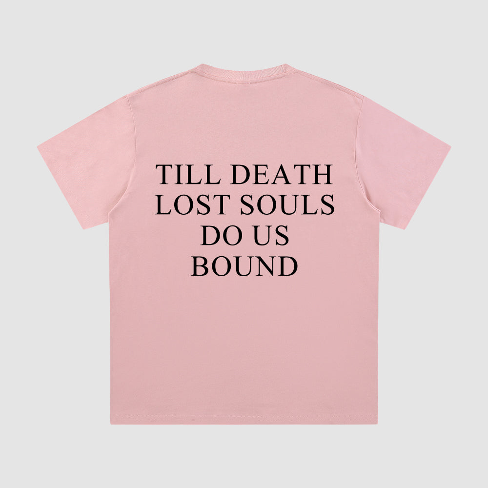 Pink t-shirt with black text on a light gray background