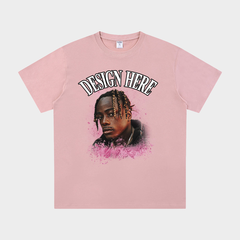 Pink t-shirt with a graphic of a person and 'Design Here' text on a white background