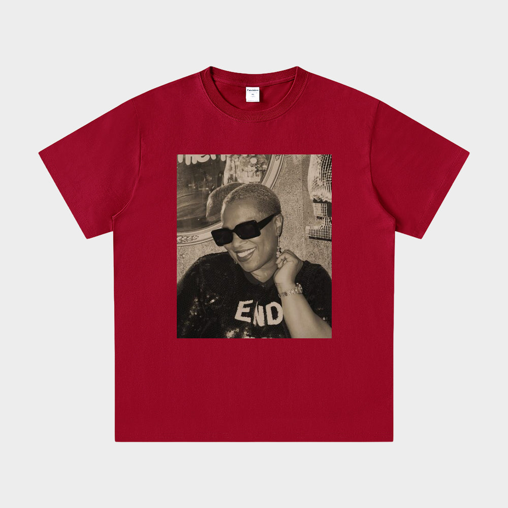 Red t-shirt with a graphic of a person wearing sunglasses and a cap on a white background
