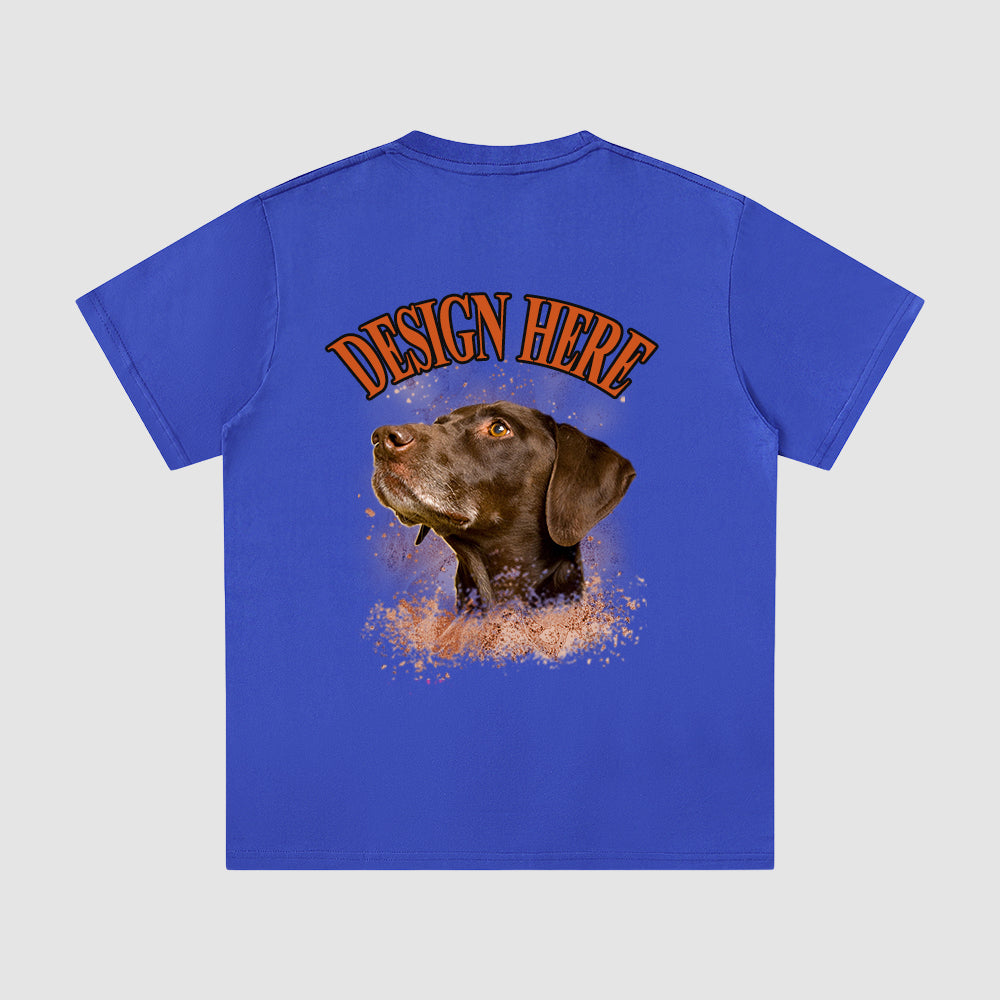 Blue t-shirt with a dog graphic and 'Design Here' text on a gray background