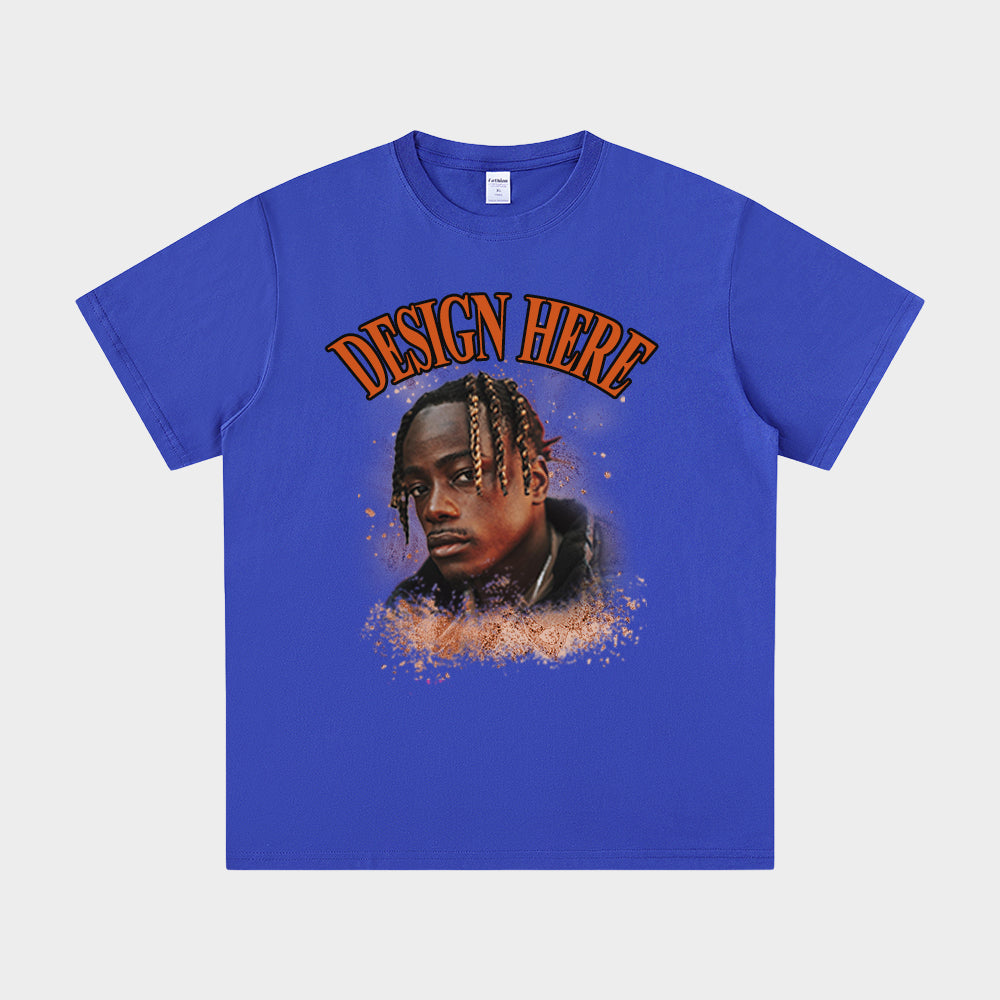 Blue t-shirt with a graphic of a person and 'Design Here' text on a white background