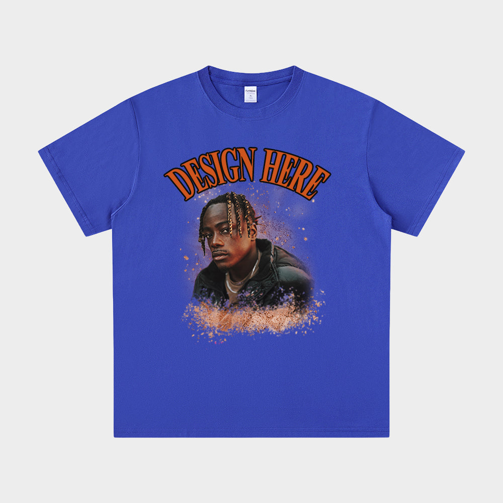 Blue t-shirt with a graphic of a person and 'Design Here' text on a white background