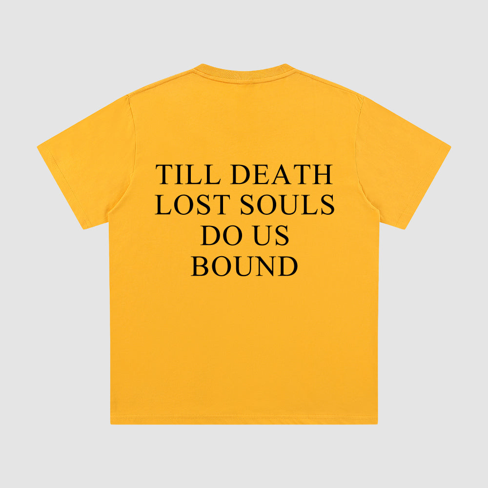 Yellow t-shirt with black text on a gray background