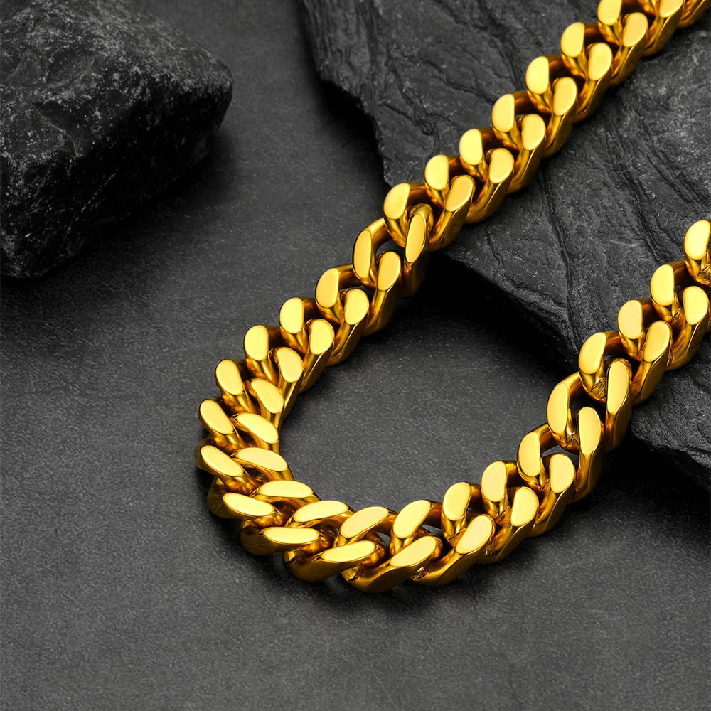 Chunky Cuban link choker necklace laid flat on white background, thick statement chain