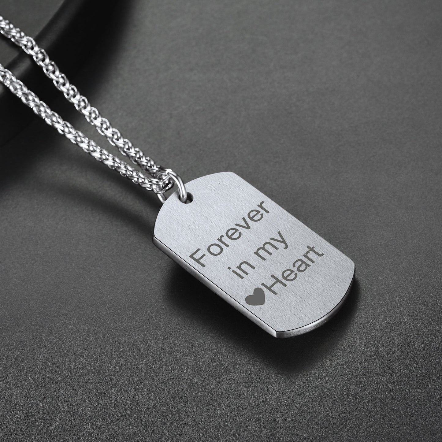 Silver dog tag pendant necklace with "Forever in my Heart" engraved.