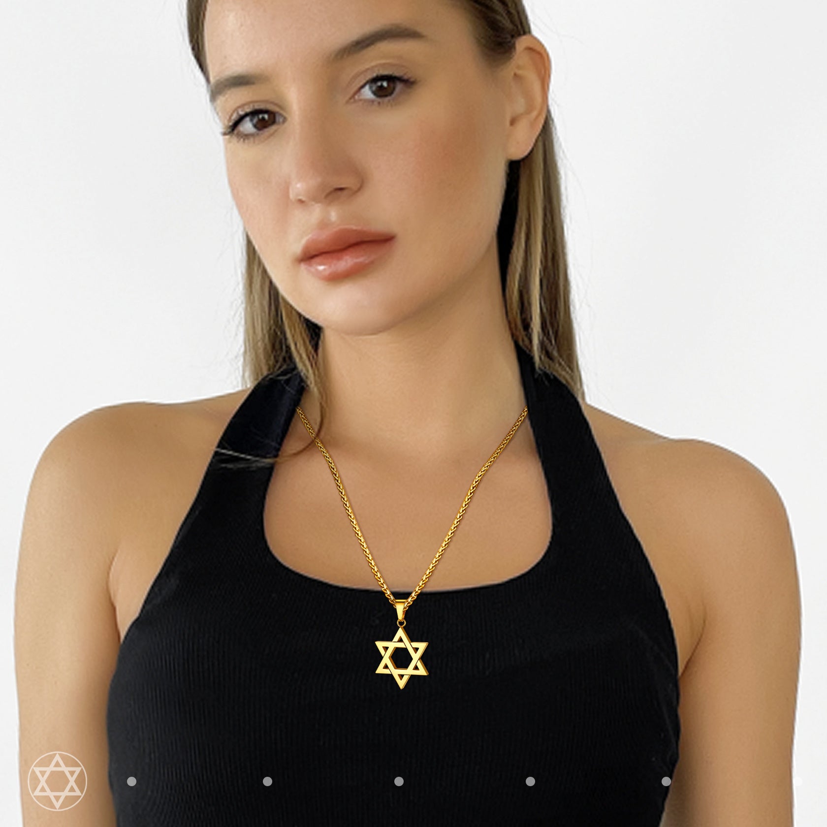Gold Star of David necklace on a woman