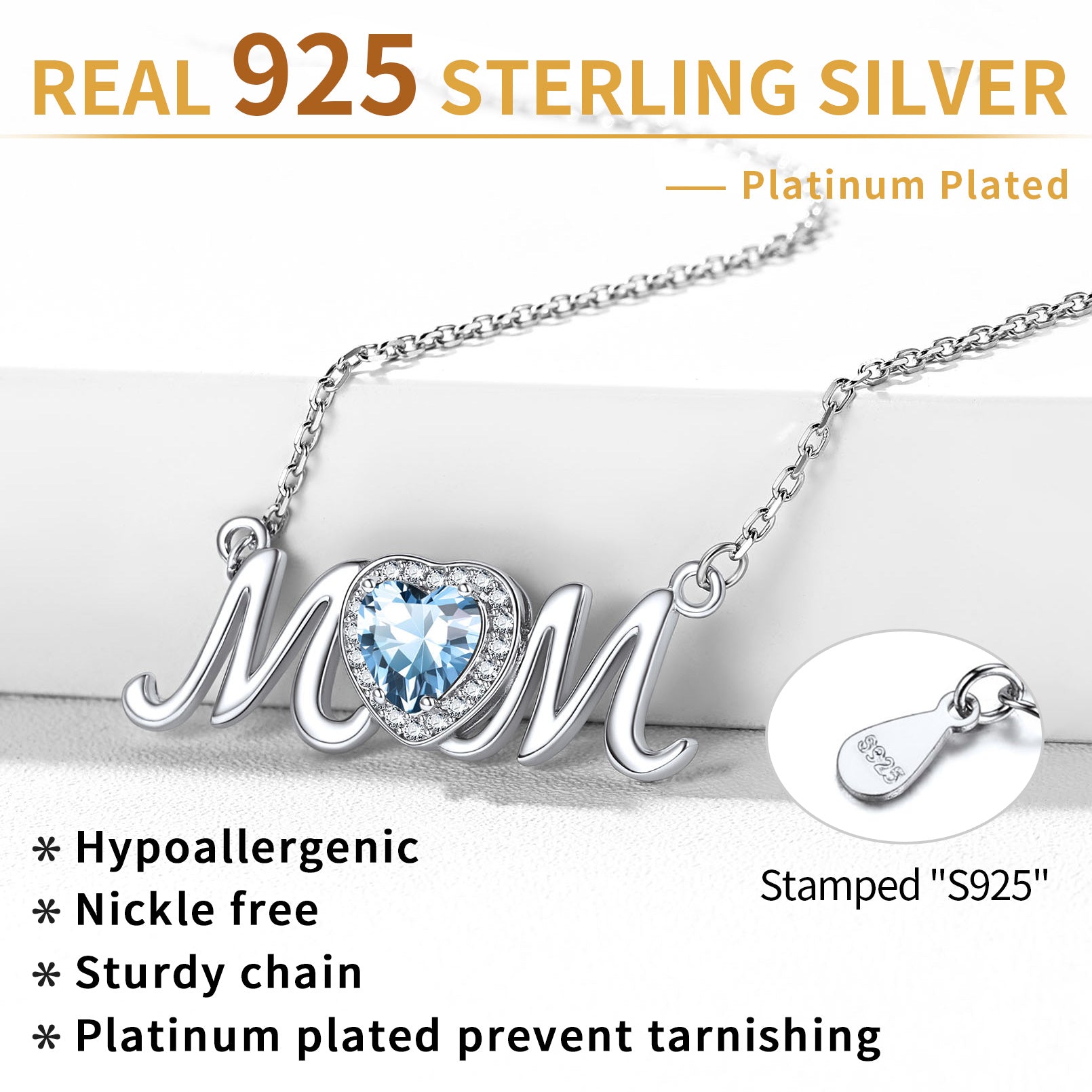 Silver 'Mom' necklace with blue heart pendant on a white background