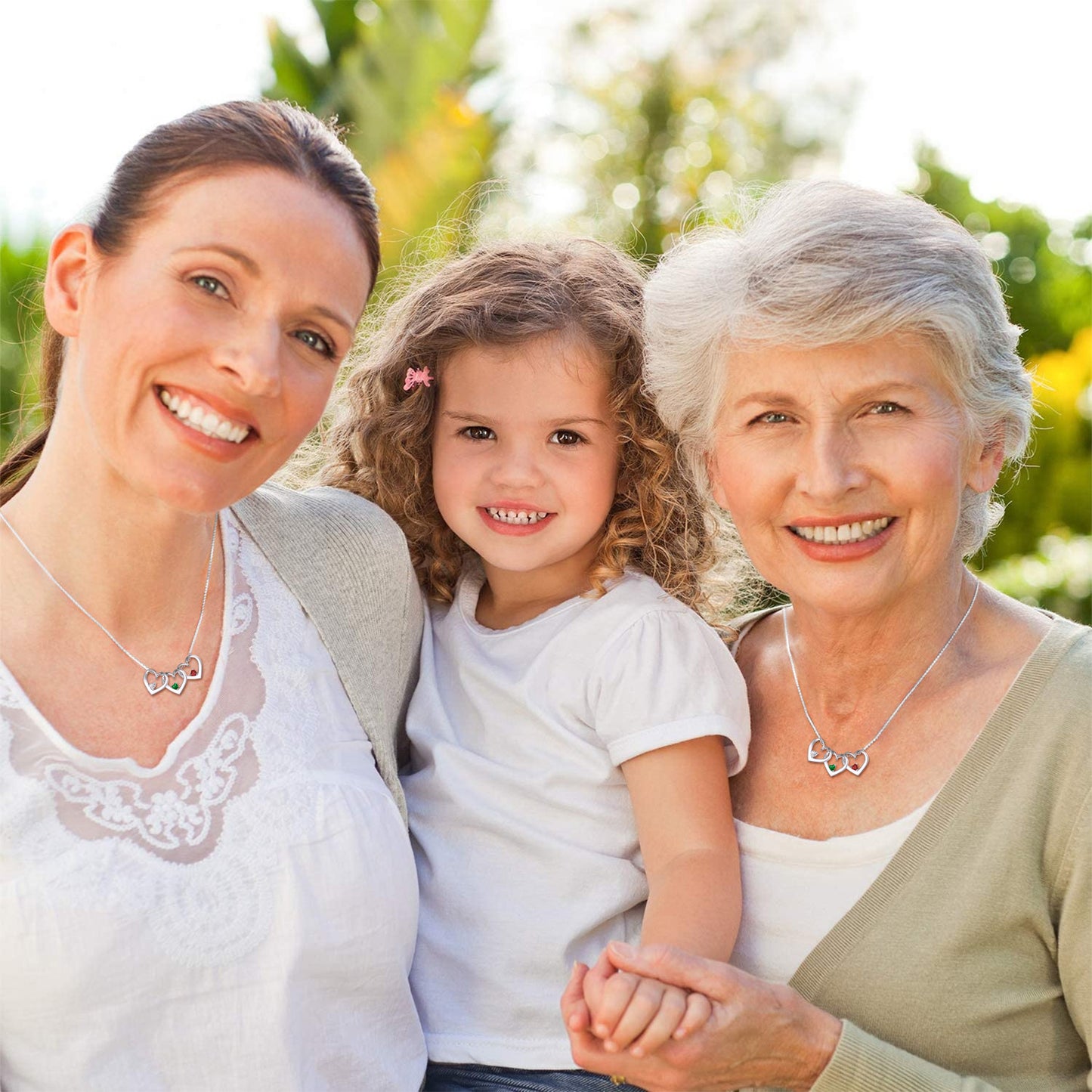 Three generations of women wearing Heart Birthstone Necklace