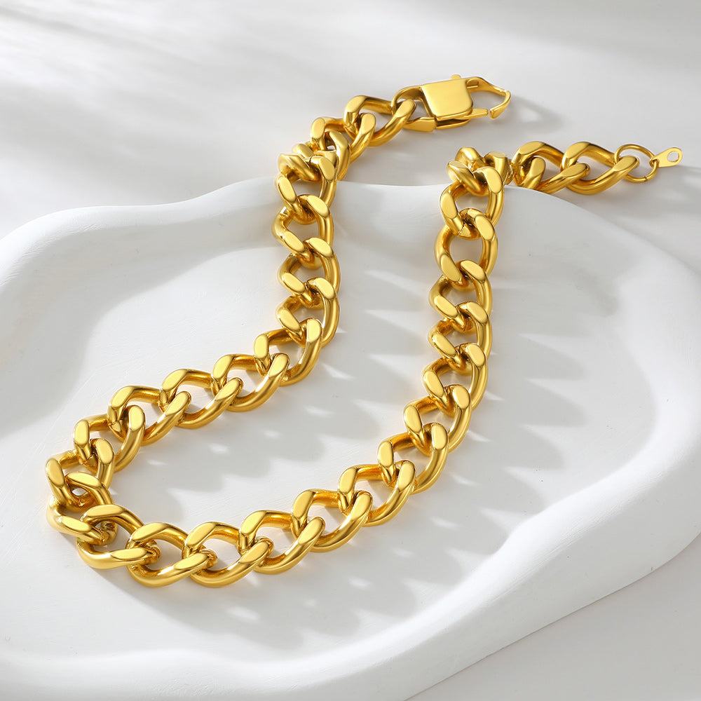 Gold chain bracelet on a white background