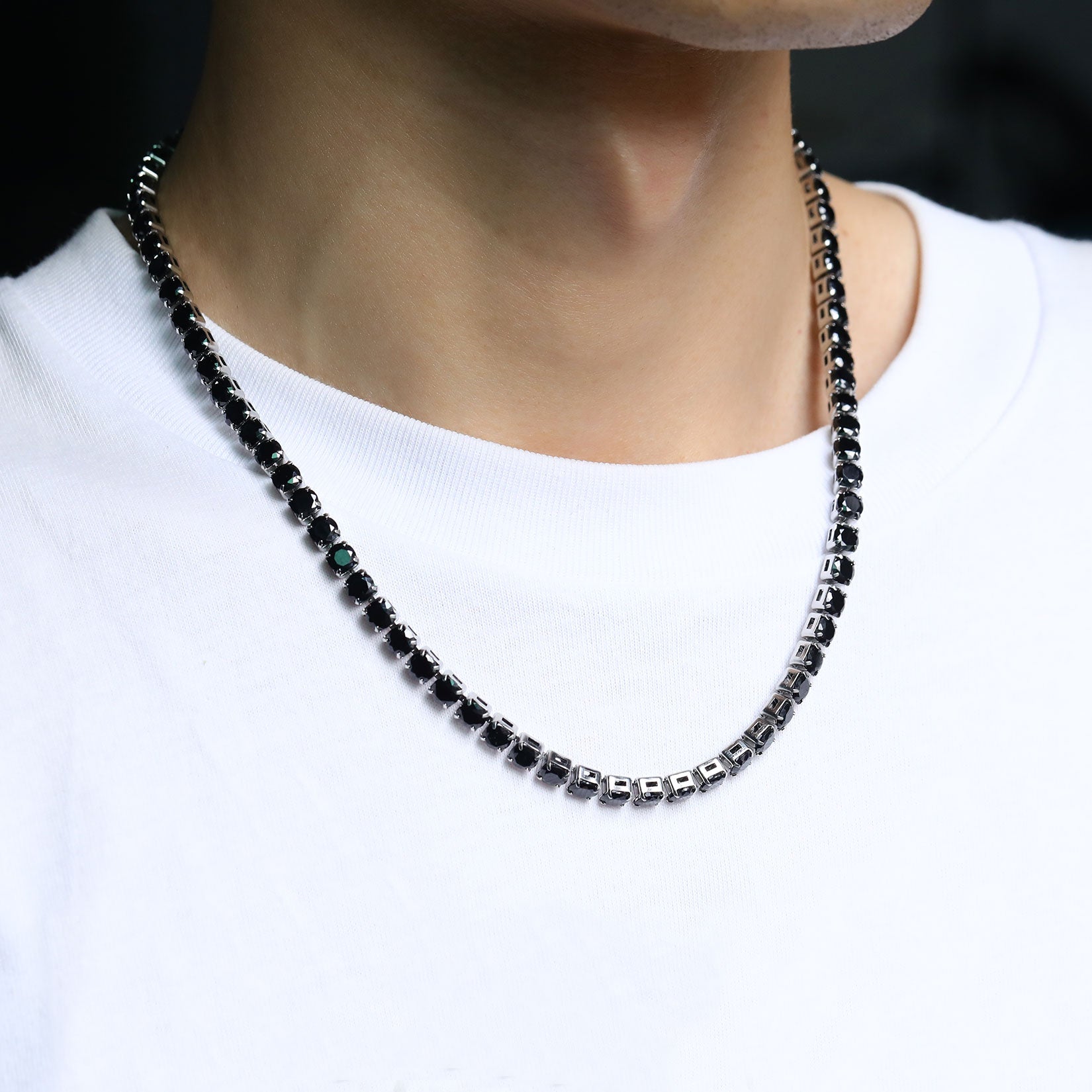 Black CZ tennis chain necklace on a man