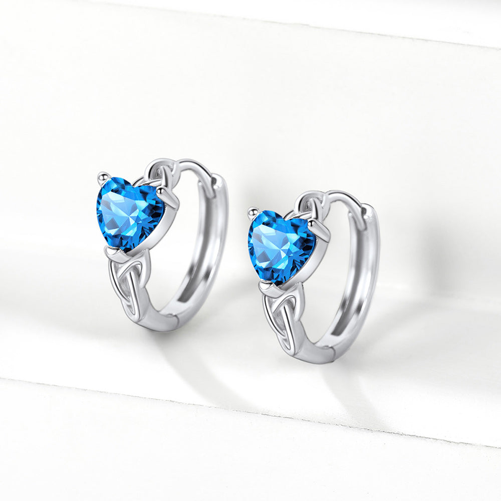 Sterling silver Celtic hoop earrings with blue heart-shaped birthstone