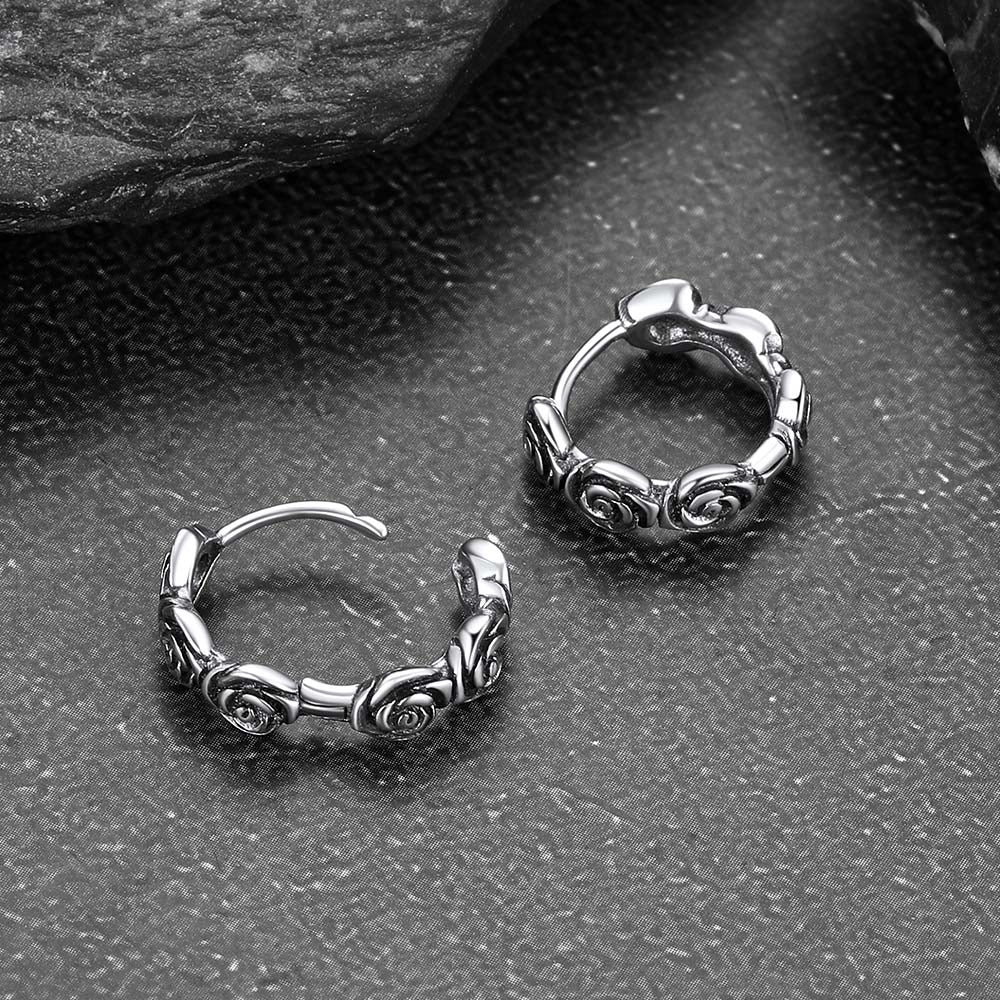 Latch-back closure detail on huggie hoop earrings