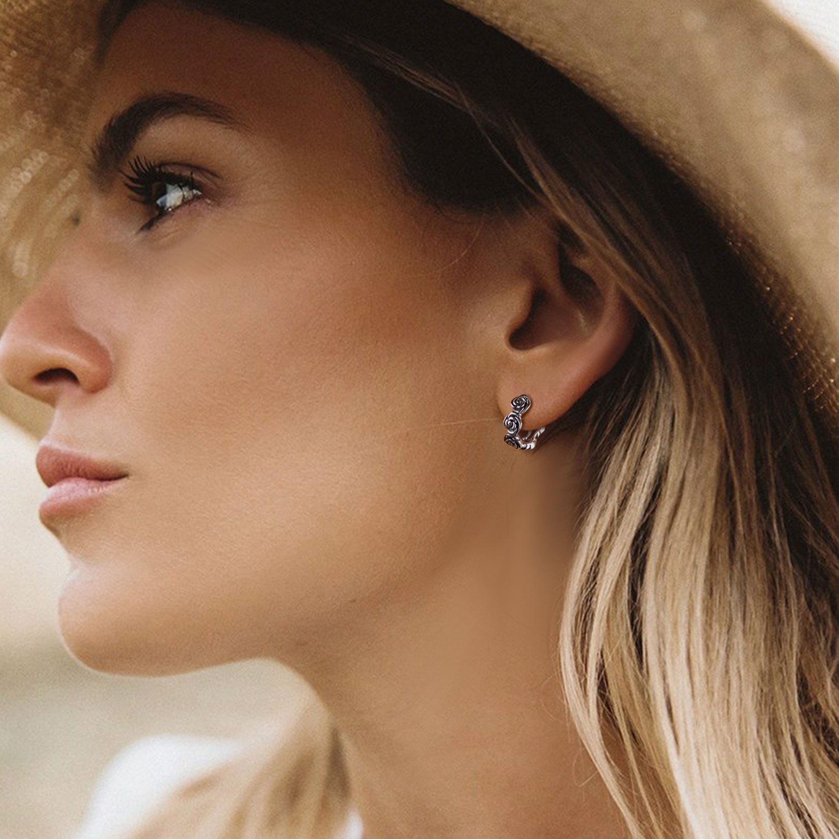 Unisex rose hoop earrings on different skin tones