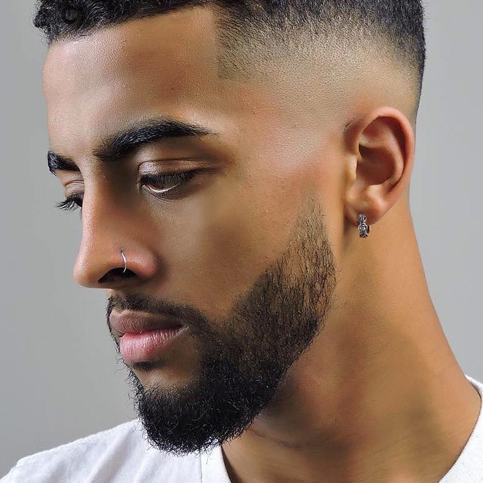 Man styling bold rose huggie hoops for me