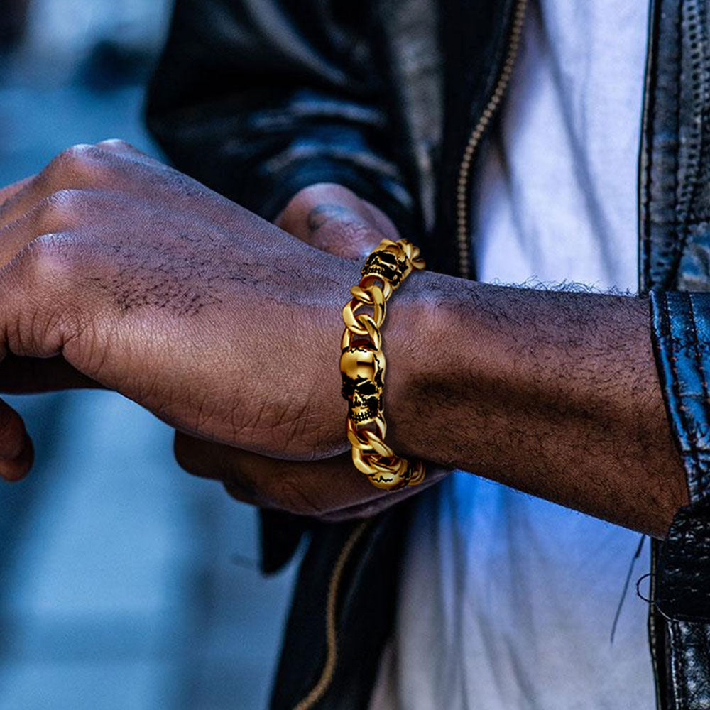 Gold skull bracelet on male wrist outfit shot