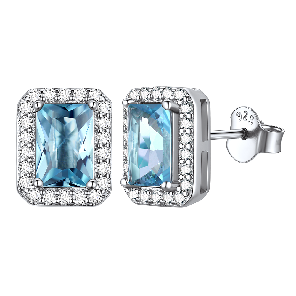 Silver stud earrings with blue cubic zirconia and a halo design