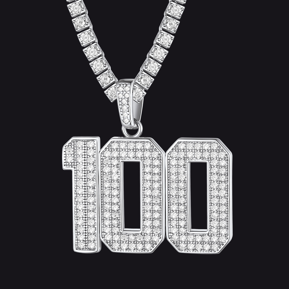 Diamond-encrusted '100' pendant on a chain against a black background