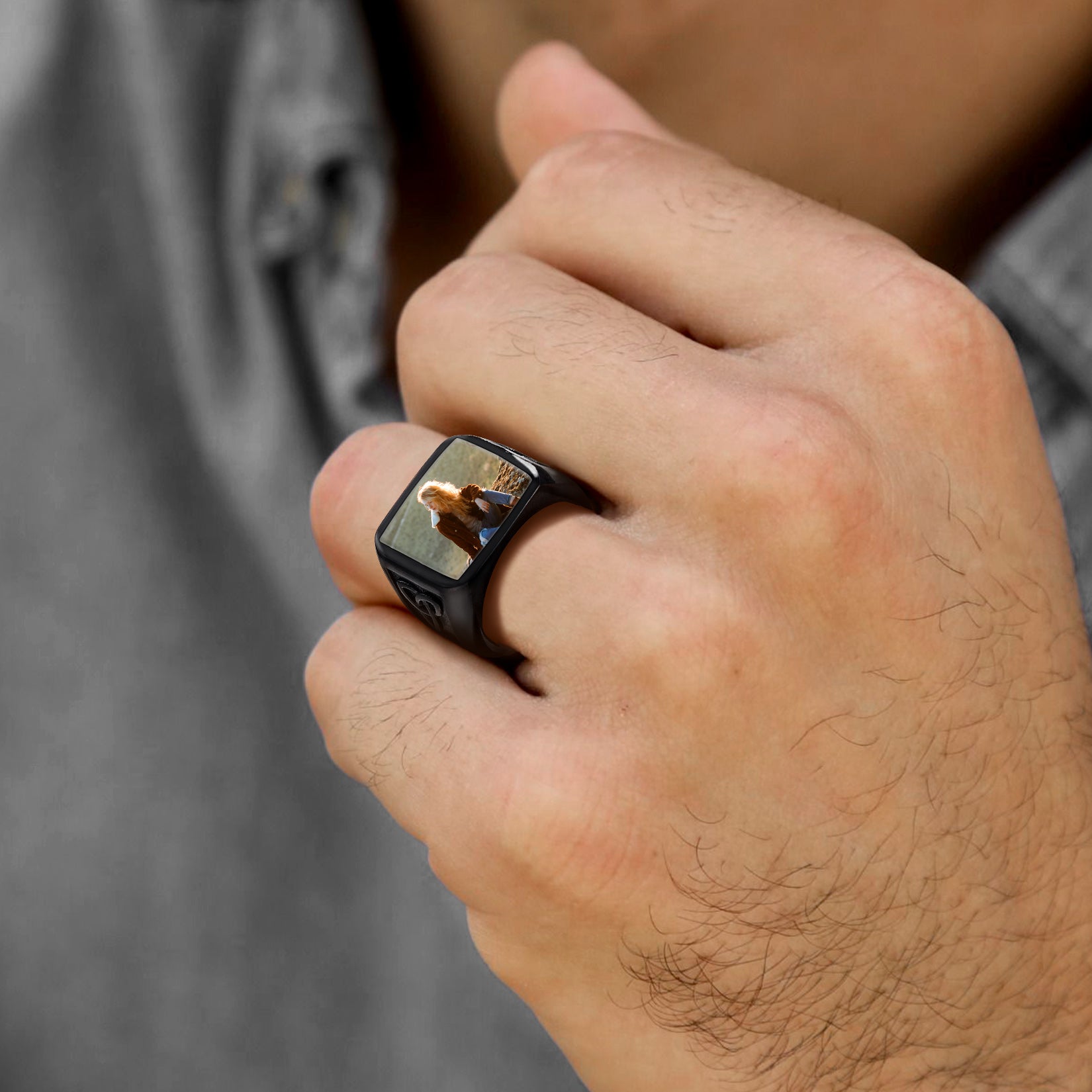 Man wearing a black personalized photo ring