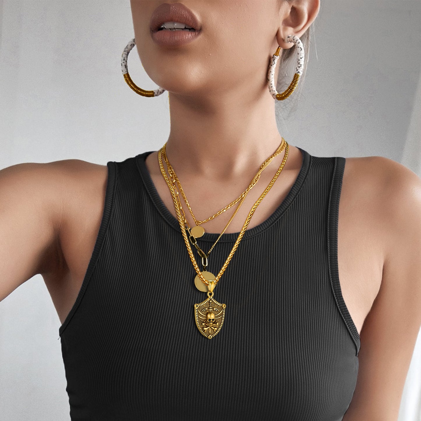 Woman wearing Viking skull necklace and gold jewelry