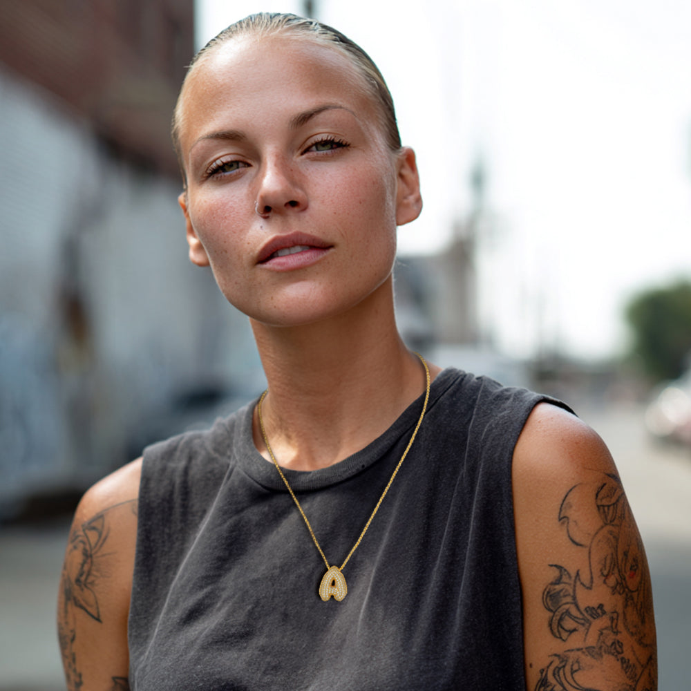 Women Wearing A Gold Bubble Letter Initial Chain Necklace