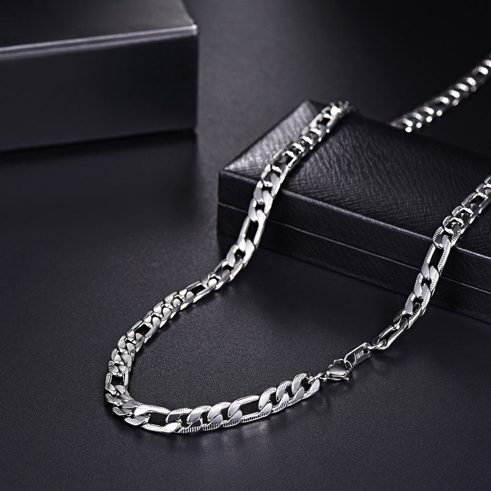 Close-up of 7mm silver Figaro links and clasp